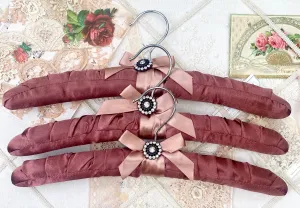 Coathangers. set of 3 . Mahogany Satin with embellishment button.
