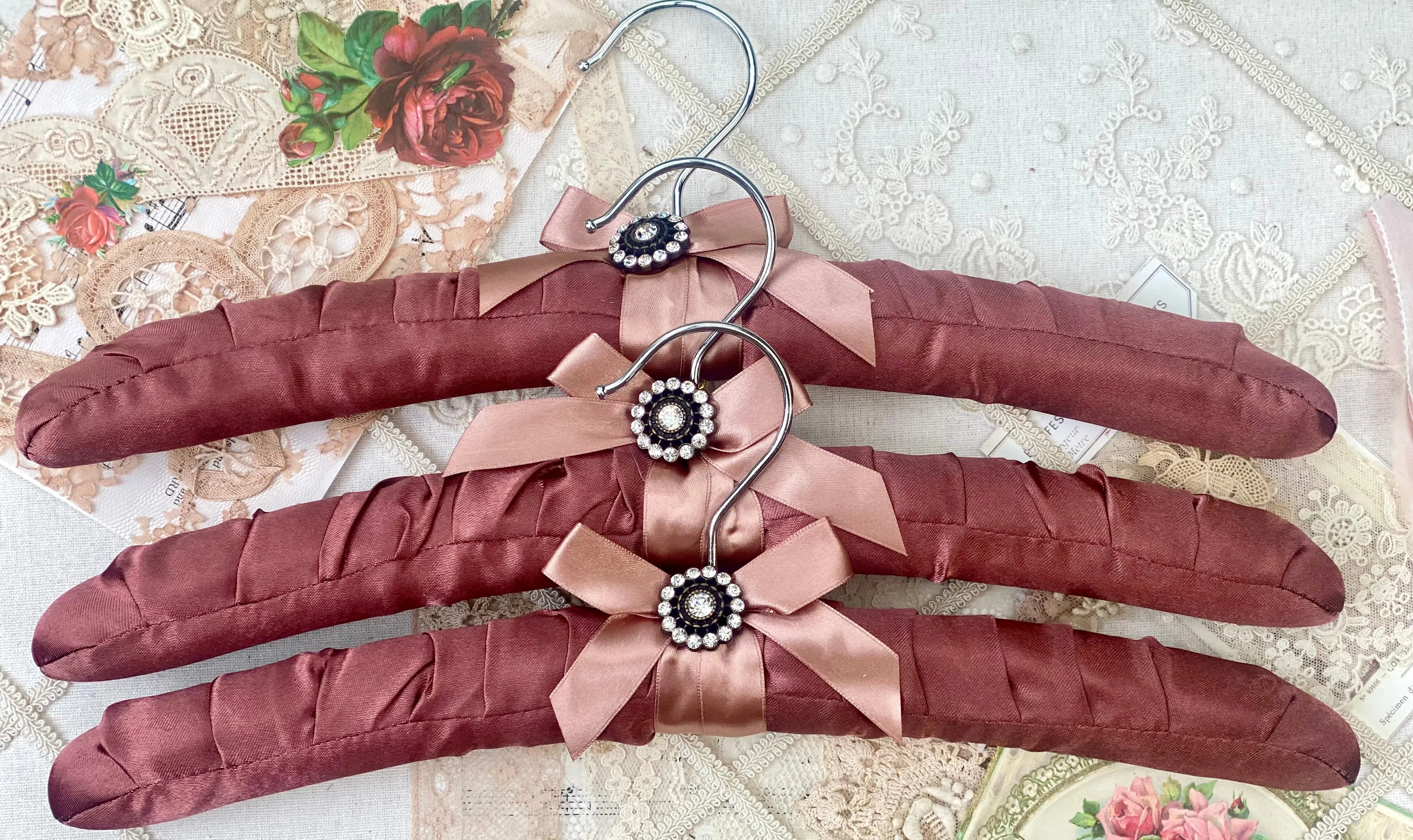 Coathangers. set of 3 . Mahogany Satin with embellishment button.