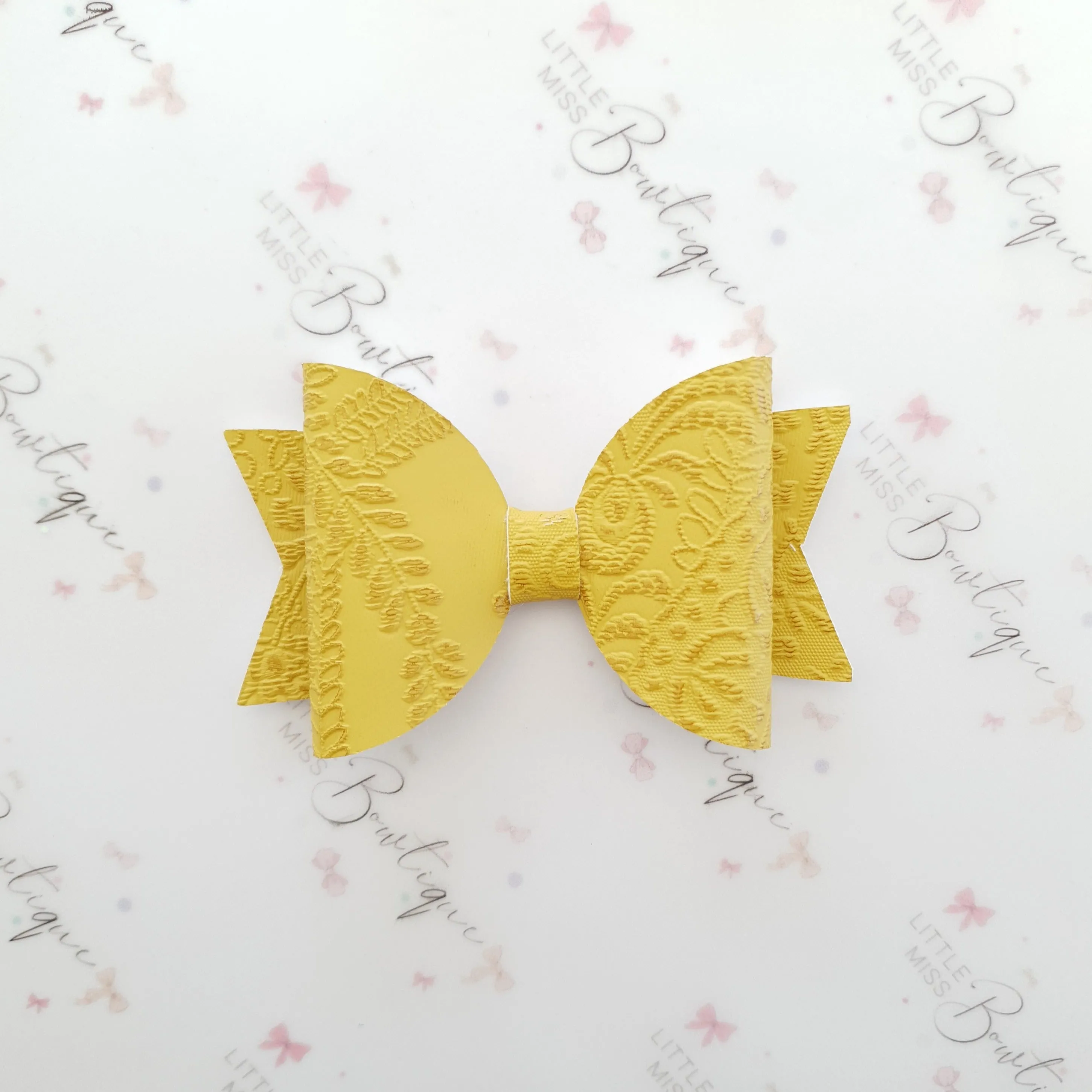 Embossed Faux Leather Bows