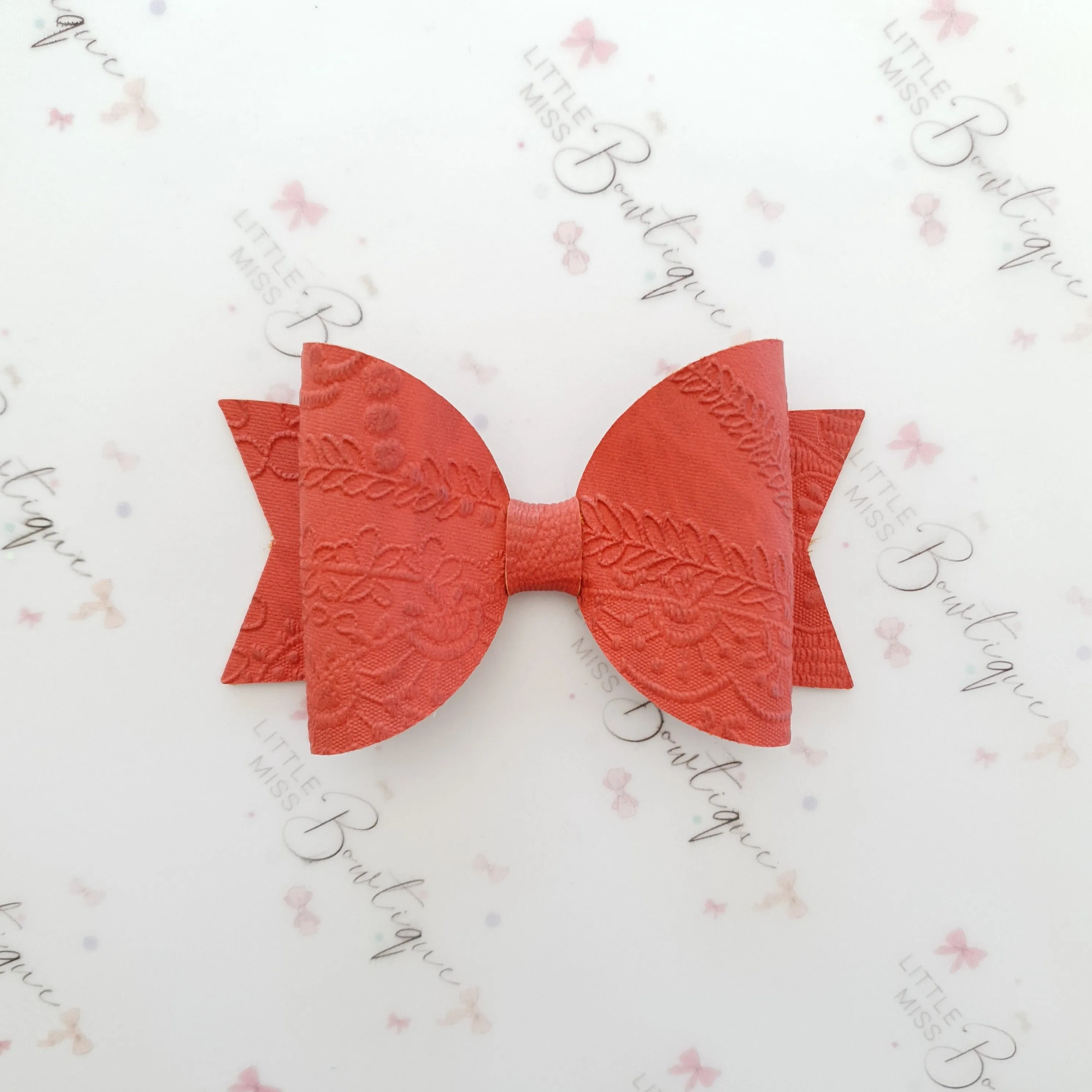 Embossed Faux Leather Bows