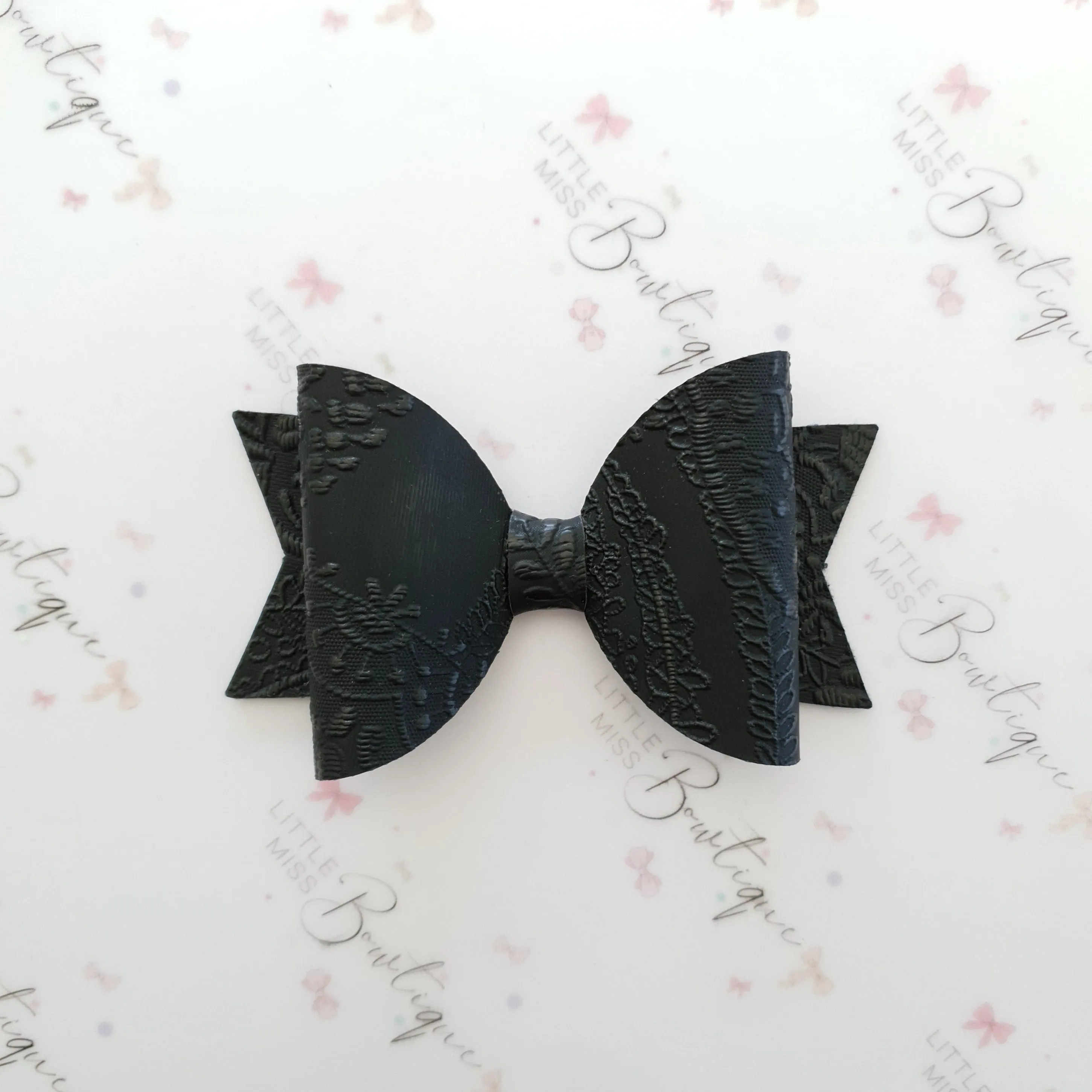Embossed Faux Leather Bows