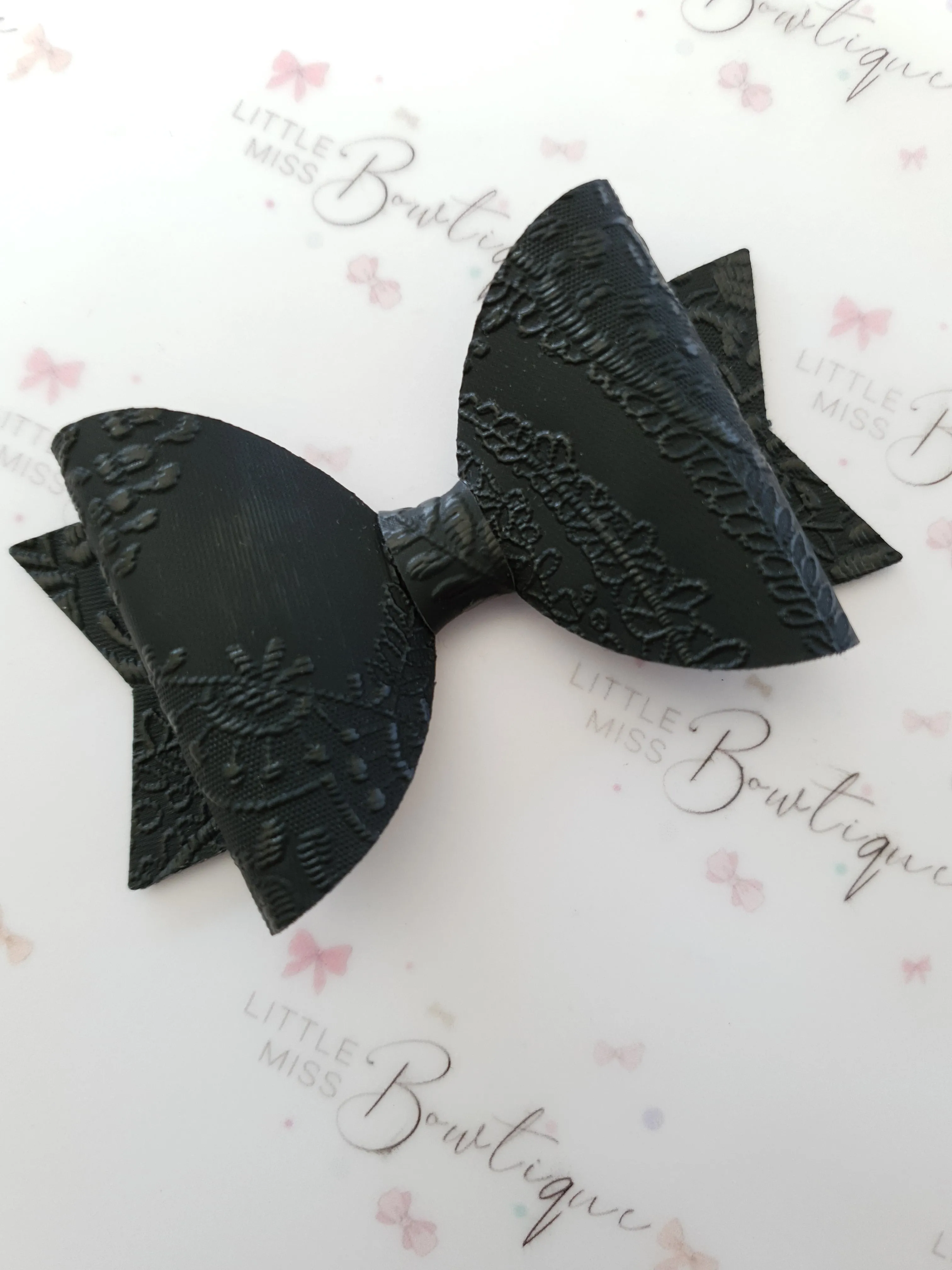 Embossed Faux Leather Bows